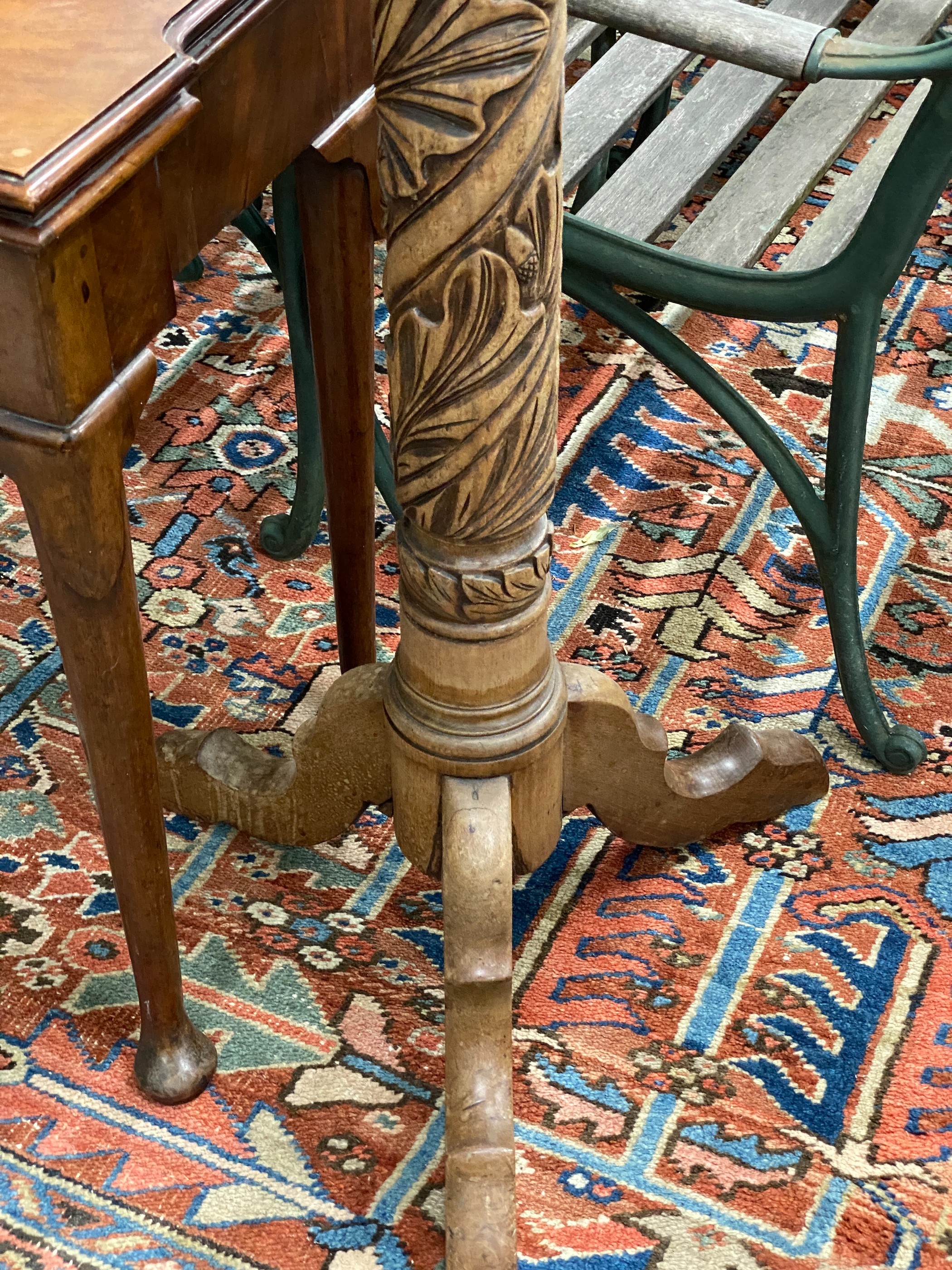 A Victorian style carved mahogany torchere, (formerly a bedpost)